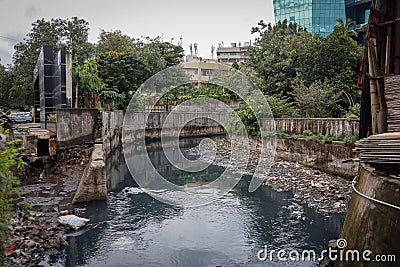 Mumbai,India,August-25-2019:Open sewage gutter running through busy resedential location: Open sewage poses health hazards to Editorial Stock Photo