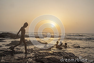 Mumbai, Maharashta / India - May 21 2020: Young children bathing and playing with friends group Editorial Stock Photo