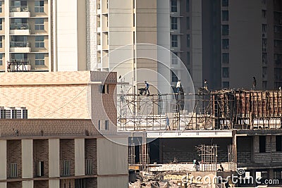 Mumbai, Maharashtra, India - January 2021: A building under construction in a dense, high rise residential neighbourhood in the Editorial Stock Photo