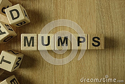 Mumps word from wooden blocks Stock Photo