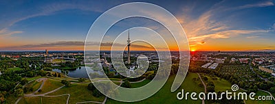 Munich, bavaria. Breathtaking view at the bavarian capital at orange sunrise with typical landmarks for tourism Editorial Stock Photo
