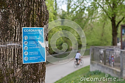Health safety posters in the green areas of Munich Germany for Coronavirus covid-19 Editorial Stock Photo