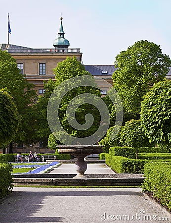 Munich, Germany - Hofgarten, ornamental fountain and green Editorial Stock Photo