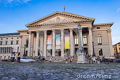 Munich, Germany - July 6, 2022: Evening at the National Theatre German: Nationaltheater on the Max Joseph square. Historic opera Editorial Stock Photo