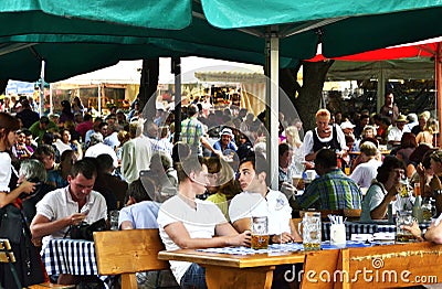 Biergarten beer garden is the most famous beer hall in Munich. Editorial Stock Photo