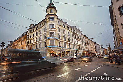 Busy street with motion transportation and famous Shelling Salon restaurant Editorial Stock Photo