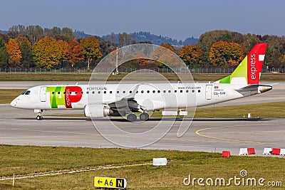 TAP Portugal Express Embraer ERJ 190 airplane Munich Airport in Germany Editorial Stock Photo