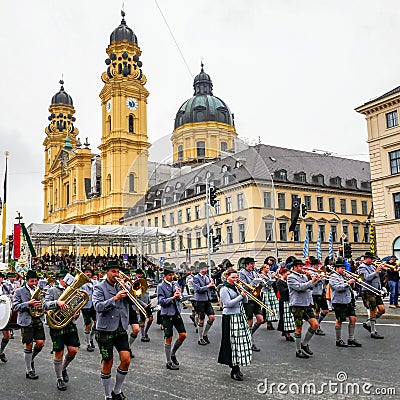 MUNICH, Germany - September 17, 2017: Octoberfest Opening Parade, with traditional Musicians and Cityscape Editorial Stock Photo
