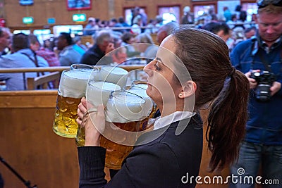 MUNICH, GERMANY - 25 SEPTEMBER 2014: Oktoberfest,Bavaria, Munich, People at the Oktoberfest,The Oktoberfest is the biggest beer Editorial Stock Photo