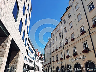 MUNICH, GERMANY - SEPTEMBER 13, 2018: Street scene outside the Weisses Schneider Brauhaus restaurant of traditional Bavarian Editorial Stock Photo