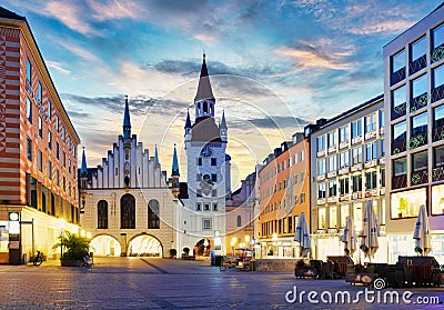 Munich Old town, Marienplatz square and the Old Town Hall tower, Germany, on dramatical sunrise Stock Photo