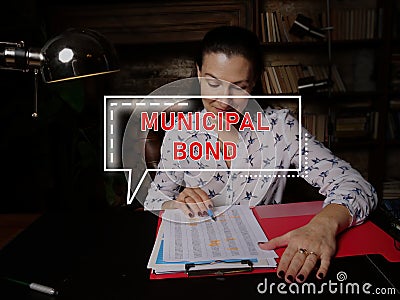 MUNICIPAL BOND phrase on the screen. Auditor checking financial report Stock Photo