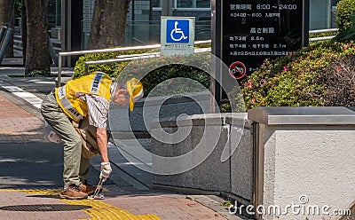 Municipal Worker In Shinjuku Street, Tokyo, Japan Editorial Stock Photo