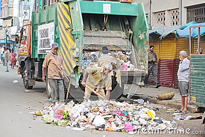 Municipality workers Clearing the wastage Editorial Stock Photo