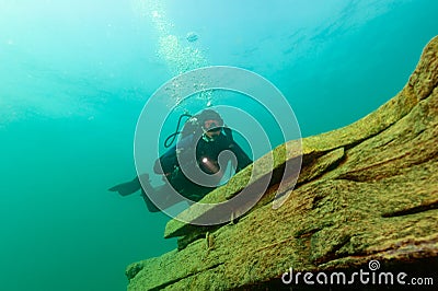 Munising, MI -August 14th, 2021: SCUBA diver exploring Lake Superior Editorial Stock Photo