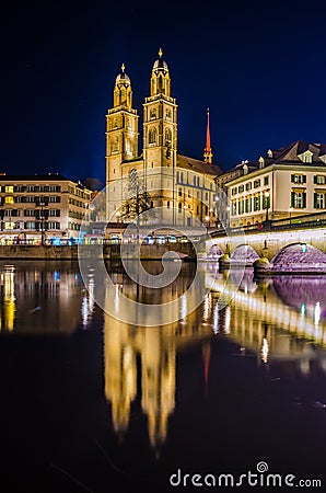 Munsterbrucke and Grossmunster church reflecting in river Limmat, Zurich, Switzerland...IMAGE Editorial Stock Photo