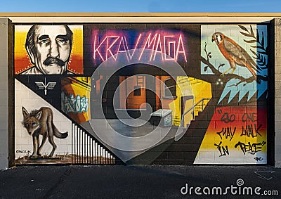 Mural by Jeremy Navarrete on an outside wall of a Krav Maga training center in Fayetteville, Arkansas. Editorial Stock Photo