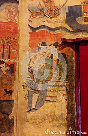 Mural painting of a man whispering to ear of a women in wat Phumin, nan, thailand Stock Photo