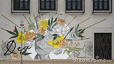 Mural titled Dea painted by artist Alli Koch on the side of the Dea Restaurant in Dallas, Texas. Editorial Stock Photo