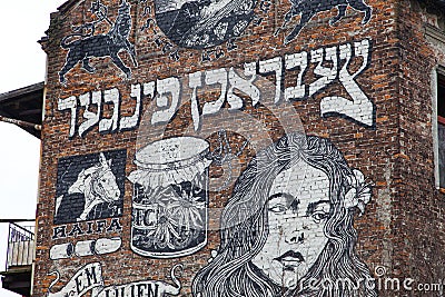 Mural on the wall of old building in jewish district of Krakow Editorial Stock Photo