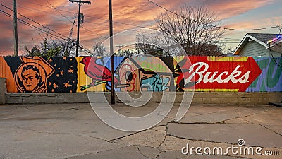 Murals on a wooden fence at Buck Atom`s Cosmic Curios on Route 66 in Tulsa, Oklahoma. Editorial Stock Photo