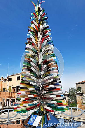 Murano, near Venice, Italy. Christmas Tree made of colourful glass tubes. The inscription Editorial Stock Photo