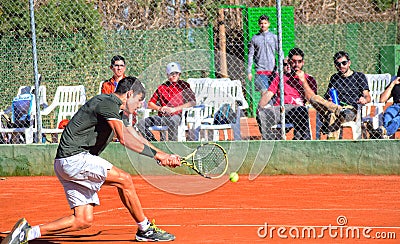Murcia, Spain, December 26, 2019: Young sportsman training at a tennis clay court in Murcia Editorial Stock Photo