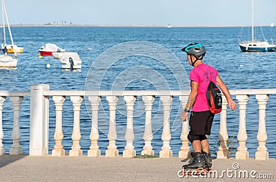 Murcia, Spain, June 2019: An elderly, senior old man, rollerblading in the park Editorial Stock Photo