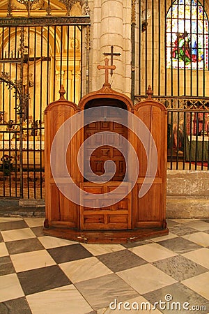Old wooden confessional in the cathedral of Murcia Editorial Stock Photo