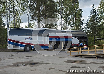 Murjek, Norrbotten, Sweden, Agust 22, 2019: Young hiker tourist get off Bussgods Bus at Train station in Murjek, Swedish Lapland. Editorial Stock Photo