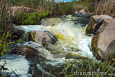 The murmuring waters of the Tokovsky waterfall in Ukraine. Stock Photo