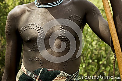 Mursi chest Omo valley Ethiopia, Africa Editorial Stock Photo