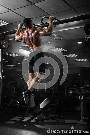 Muscle athlete man in gym making elevations Stock Photo