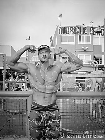 Muscle Beach bodybuilder flexing, black and white Editorial Stock Photo