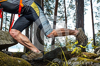 Muscled legs of the trail running athlete Stock Photo