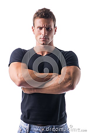 Muscled Man Crossing Arms with Serious Face Stock Photo