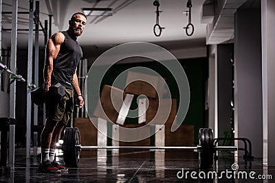 Muscular athlete preparing for weightlifting. Stock Photo