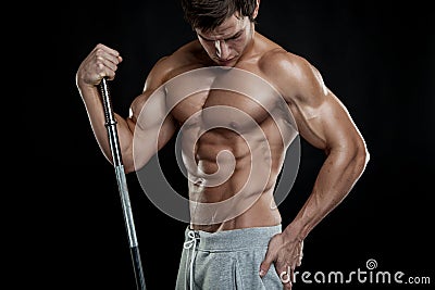 Muscular bodybuilder guy doing posing with dumbbells Stock Photo