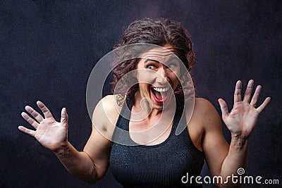 Muscular Female Weight Lifter Being Goofy Stock Photo