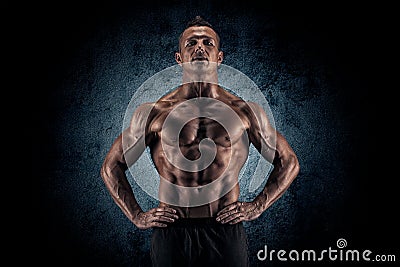 Muscular guy on black background Stock Photo