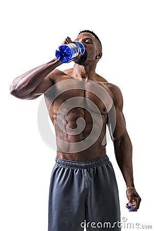 Muscular shirtless black male bodybuilder drinking protein shake from blender Stock Photo