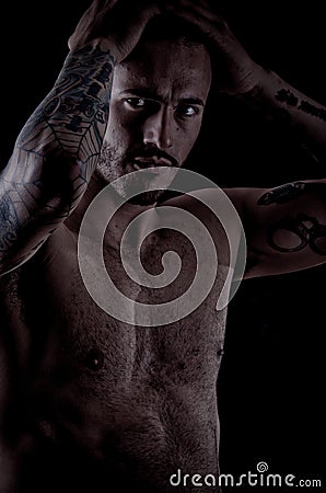 Muscular young man with many tattoos, dragan style Stock Photo