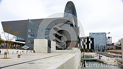 Museu del Disseny and Torre Agbar with pond in Barcelona Editorial Stock Photo