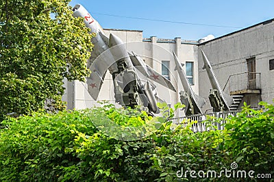 Museum of air defense Forces. Soviet fighter aircraft MIG-19 together with air defence missile system S-200 and S-125. Editorial Stock Photo