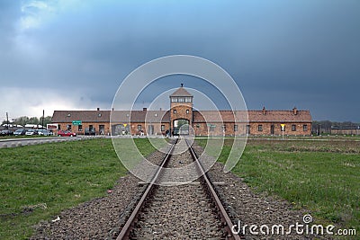 Museum Auschwitz - Birkenau. Holocaust Memorial Museum. Main entrance to the concentration camp. Editorial Stock Photo