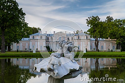 Museum Chinese Palace, a sculpture of a Triton in a Chinese pond in the summer. Editorial Stock Photo