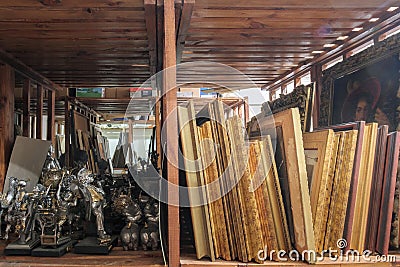 Museum storage, Wooden shelves full of pictures Editorial Stock Photo