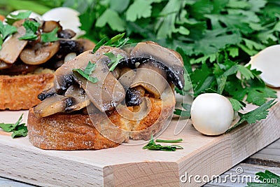 Mushroom bruschetta on table Stock Photo