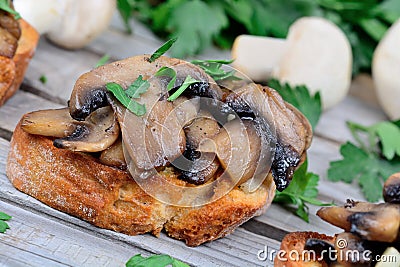 Mushroom bruschetta on table Stock Photo