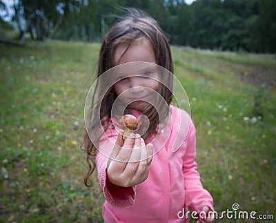 Girl with mushroom in the hands Stock Photo